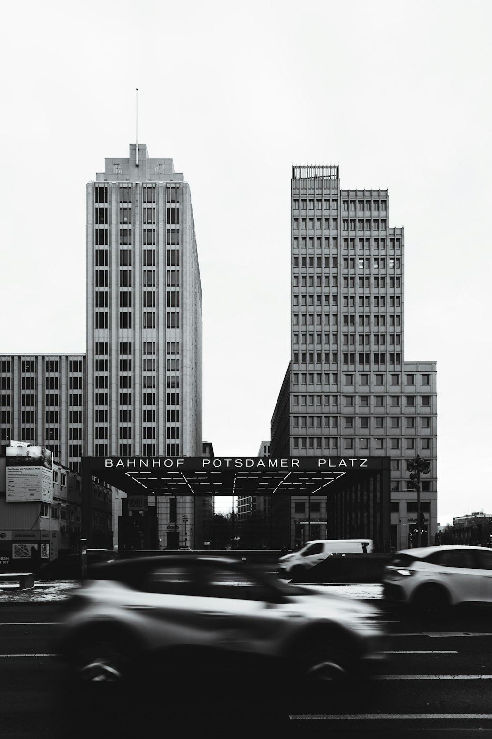 a black and white photo of a city with tall buildings