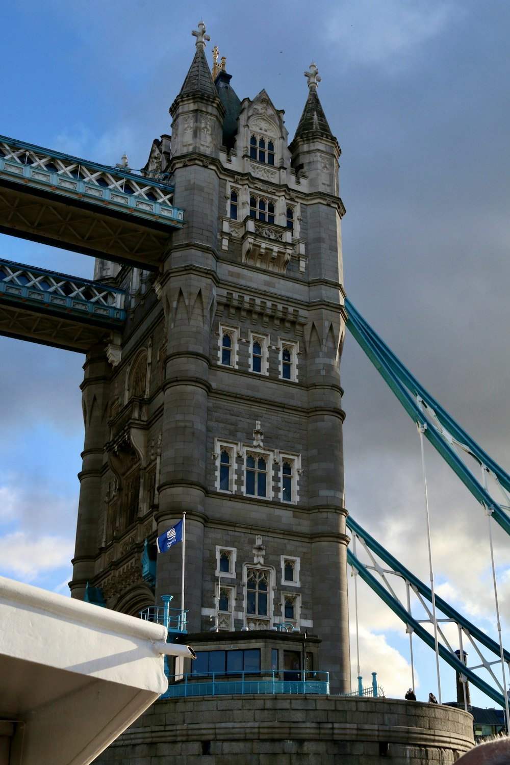 a very tall tower with a bridge in the background