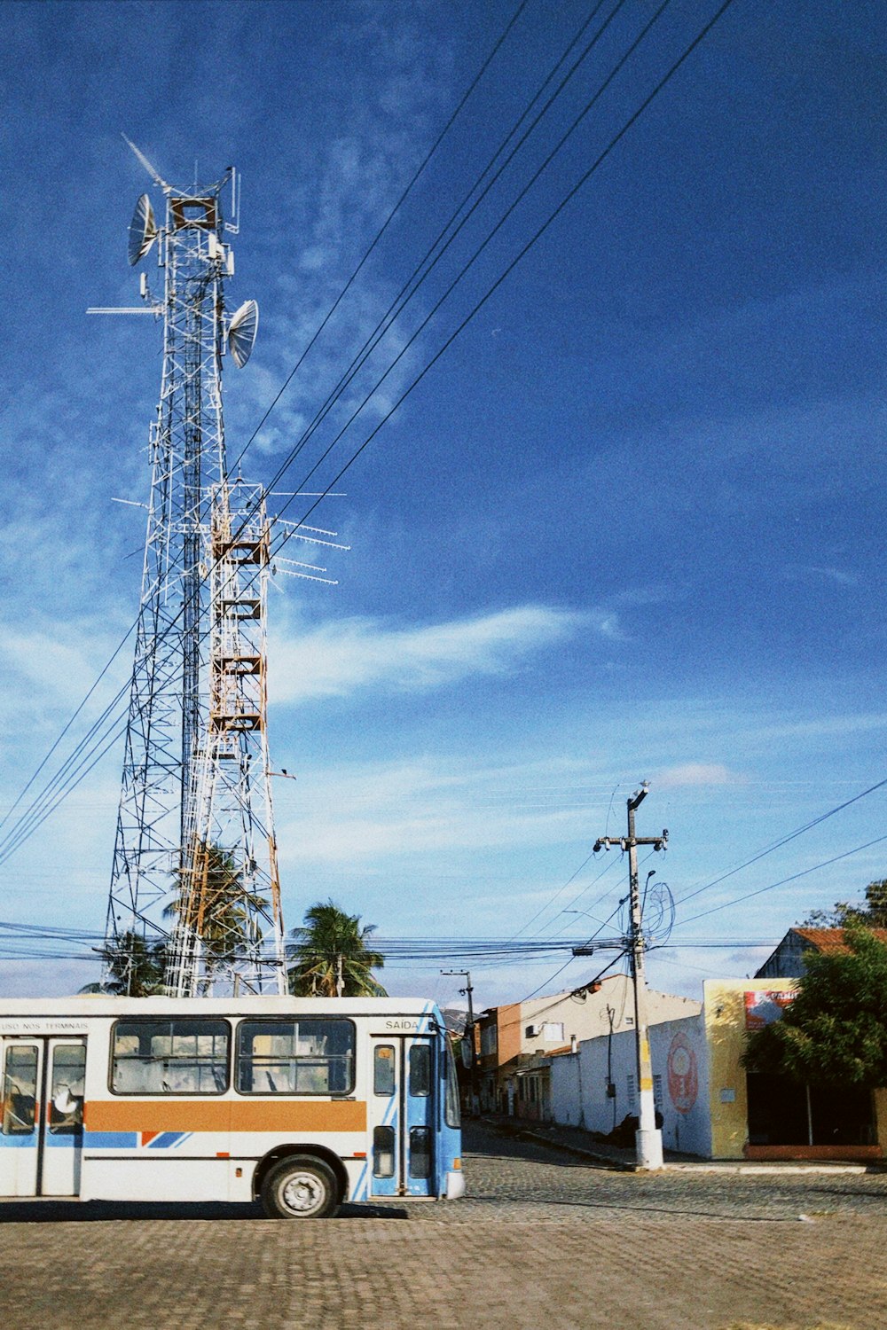 a bus parked in front of a telephone pole