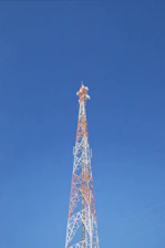a very tall tower with a clock on it's side