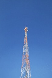 a very tall tower with a clock on it's side