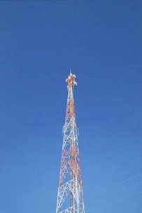 a very tall tower with a clock on it's side