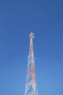 a very tall tower with a clock on it's side