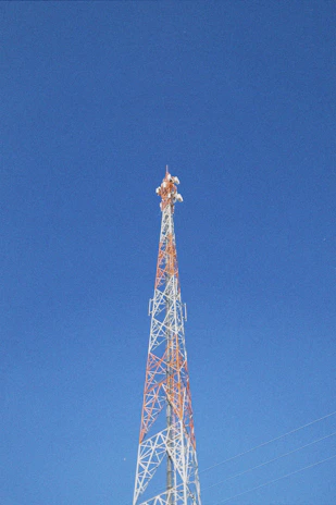 a very tall tower with a clock on it's side