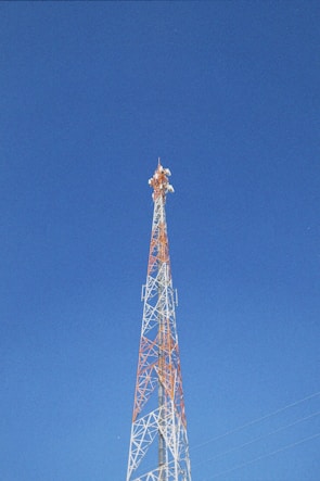 a very tall tower with a clock on it's side