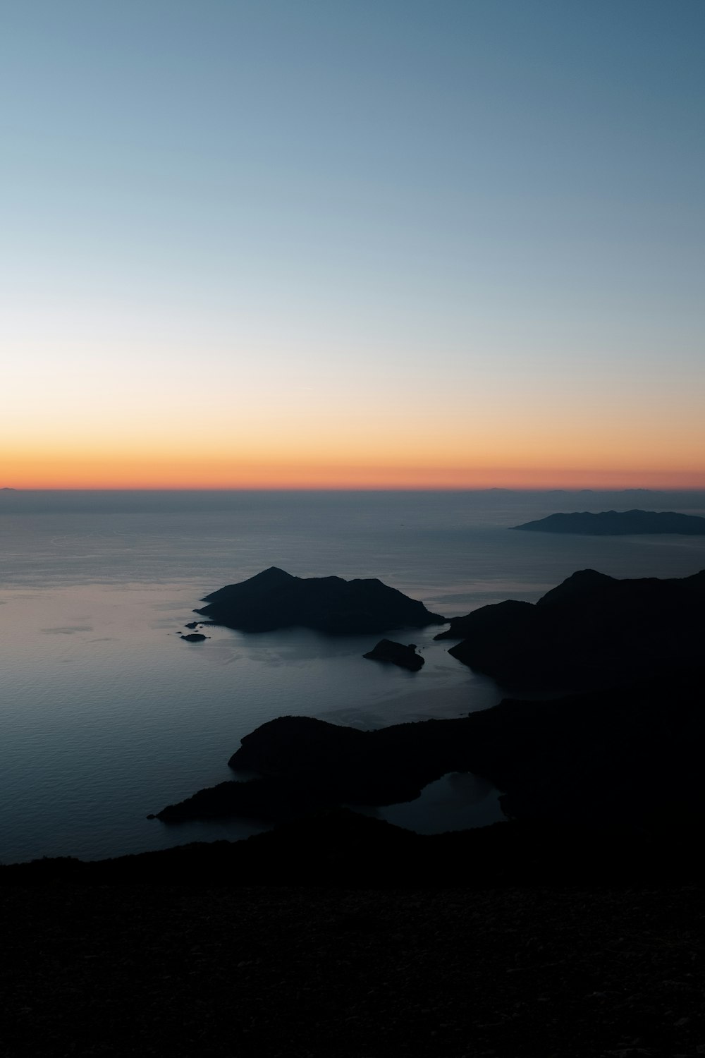 a view of a body of water at sunset