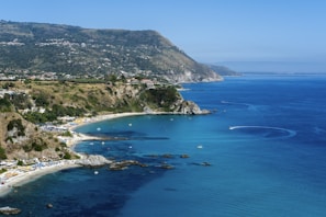 a view of a beach with a boat in the water