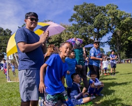 A community event showcasing youth sports activities, with families and supporters cheering on the participants.