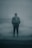 A solitary figure stands in the midst of dense fog, wearing a formal suit and tie, with an indistinct background structure adding to the mysterious atmosphere.