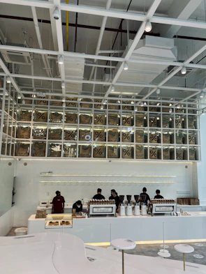Minimalist industrial interior of the tbx showroom with coffee machines on display.
