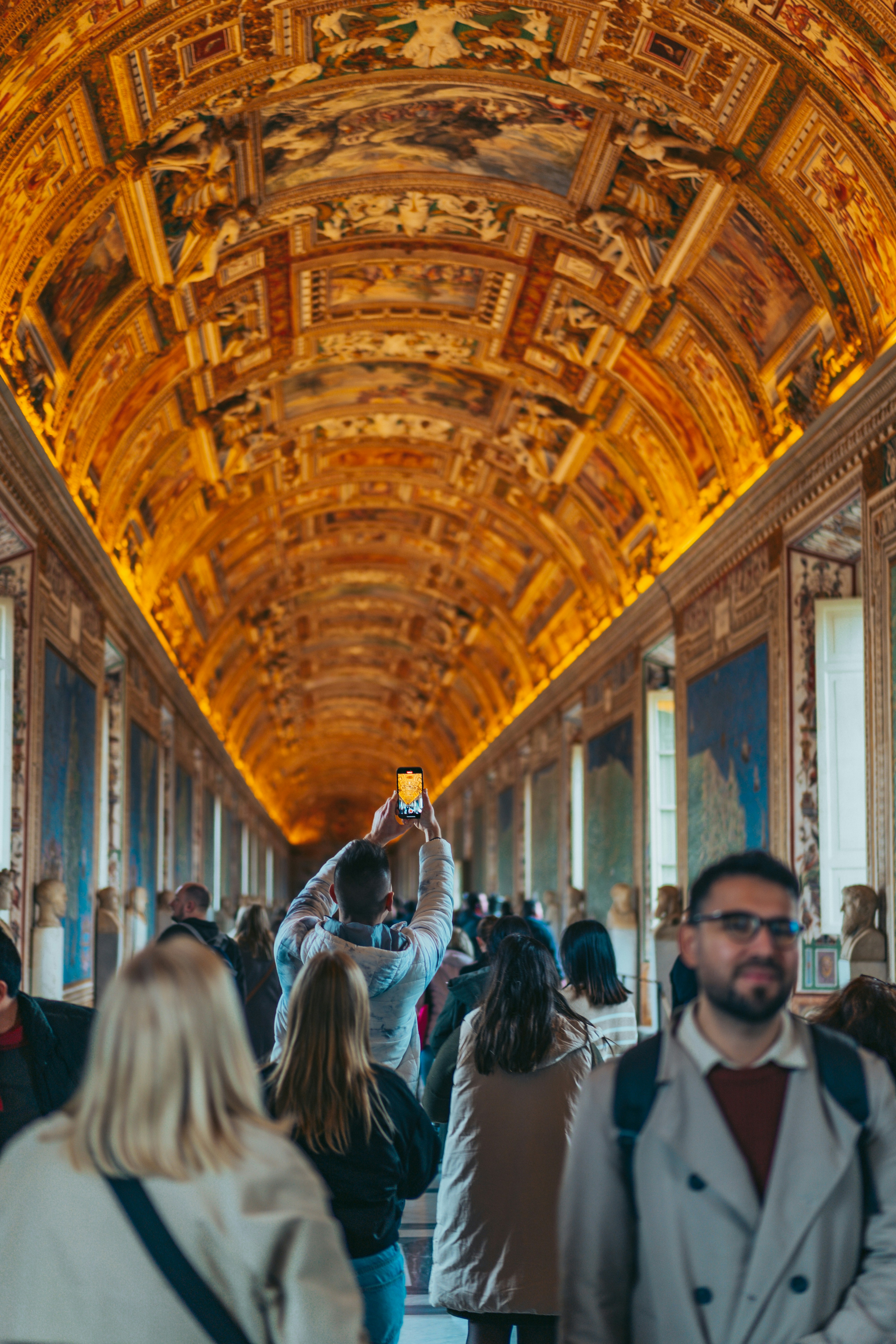 A group of people standing in a room photo – Free Building Image on ...