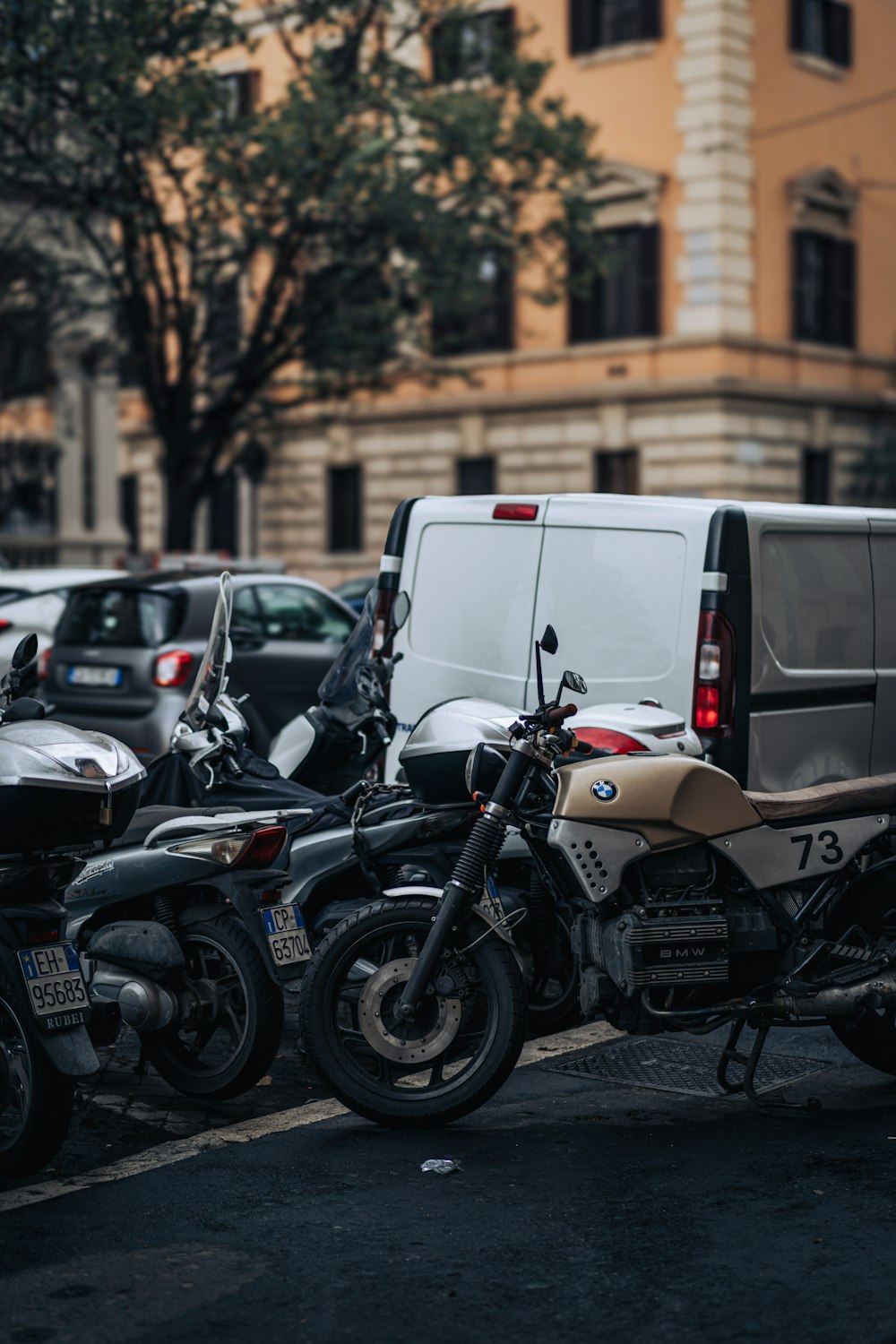 a group of motorcycles parked on the side of the road