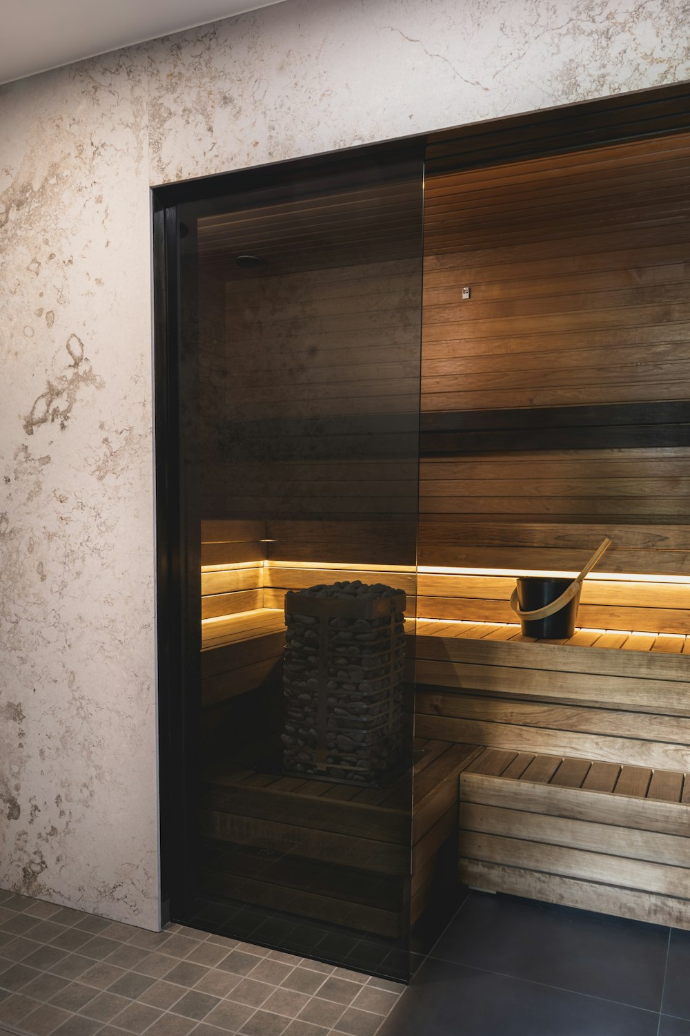 a sauna room with a sauna in the middle of it
