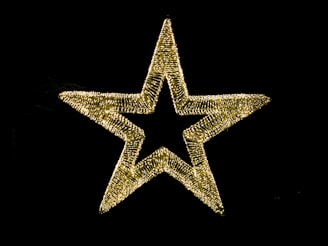 a lighted star on a black background