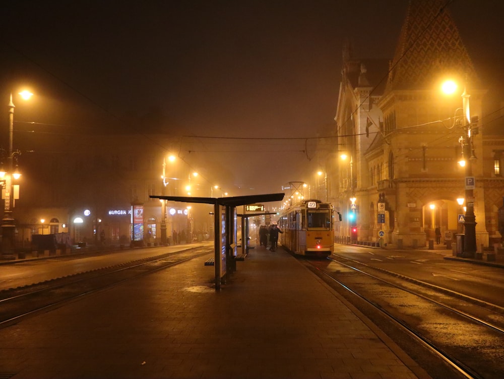 a train on a train track at night