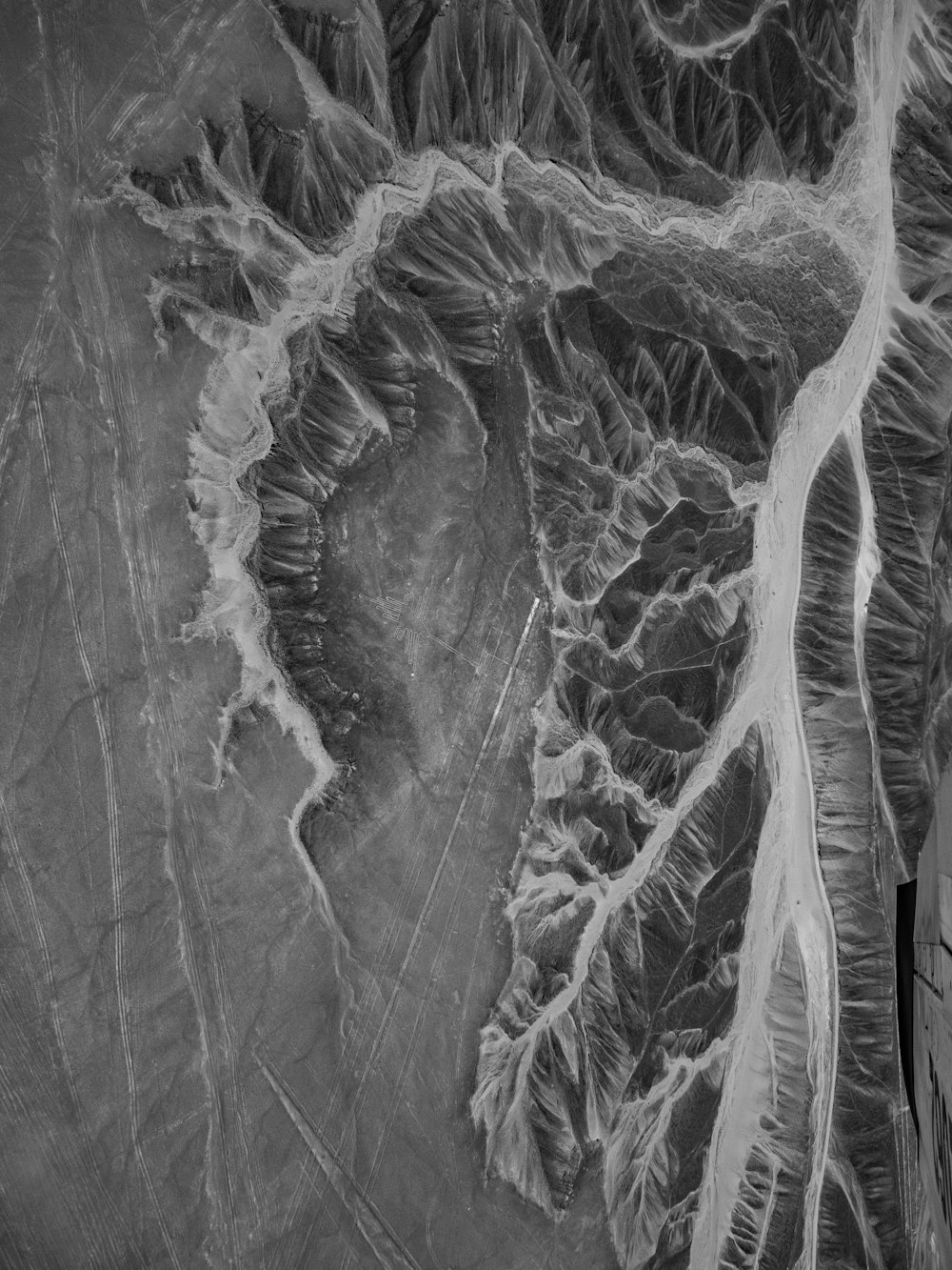 a black and white photo of an aerial view of a river