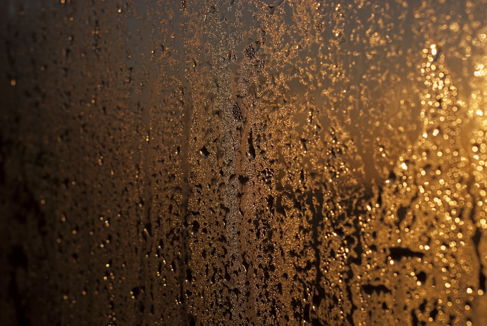 a close up of a window with rain drops on it