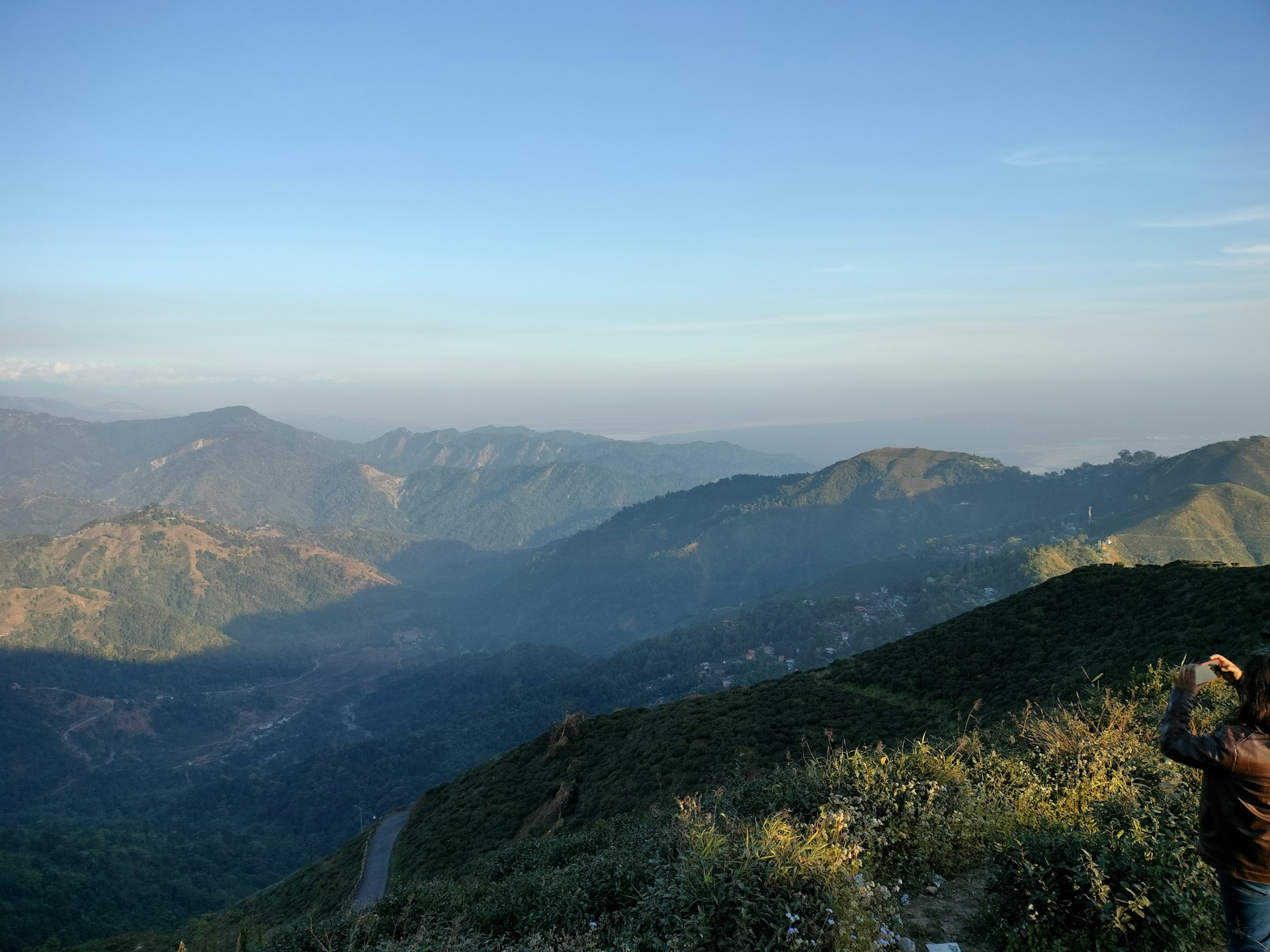 woman wearing yellow long-sleeved dress under white clouds and blue sky during daytime