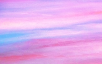 A dreamy gradient sky blending soft blues and nostalgic pinks.