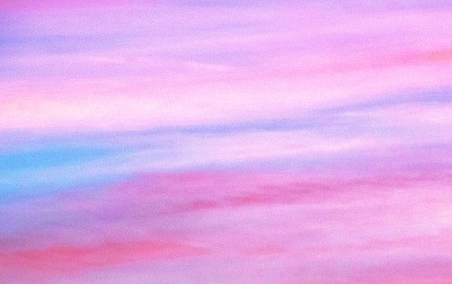 A gradient blend of pastel colors, predominantly pinks, purples, and blues, creating a soft and dreamy effect.