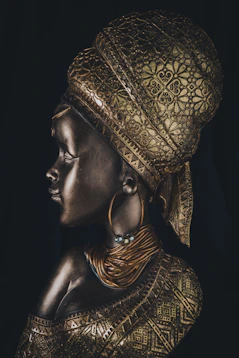 a statue of a woman wearing a gold headdress