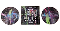 A colorful, abstract depiction of musical elements on vinyl records and a DJ mixer. The records and mixer are covered with splashes of bright neon colors including green, pink, and blue against a dark background.