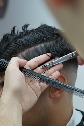 Close-up of a stylish haircut being shaped with electric clippers.