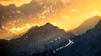 a view of a mountain range at sunset