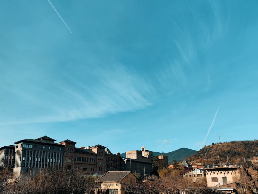 a blue sky with some clouds in the background