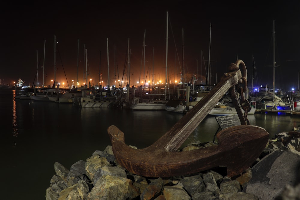 a statue of a man playing a guitar in a harbor