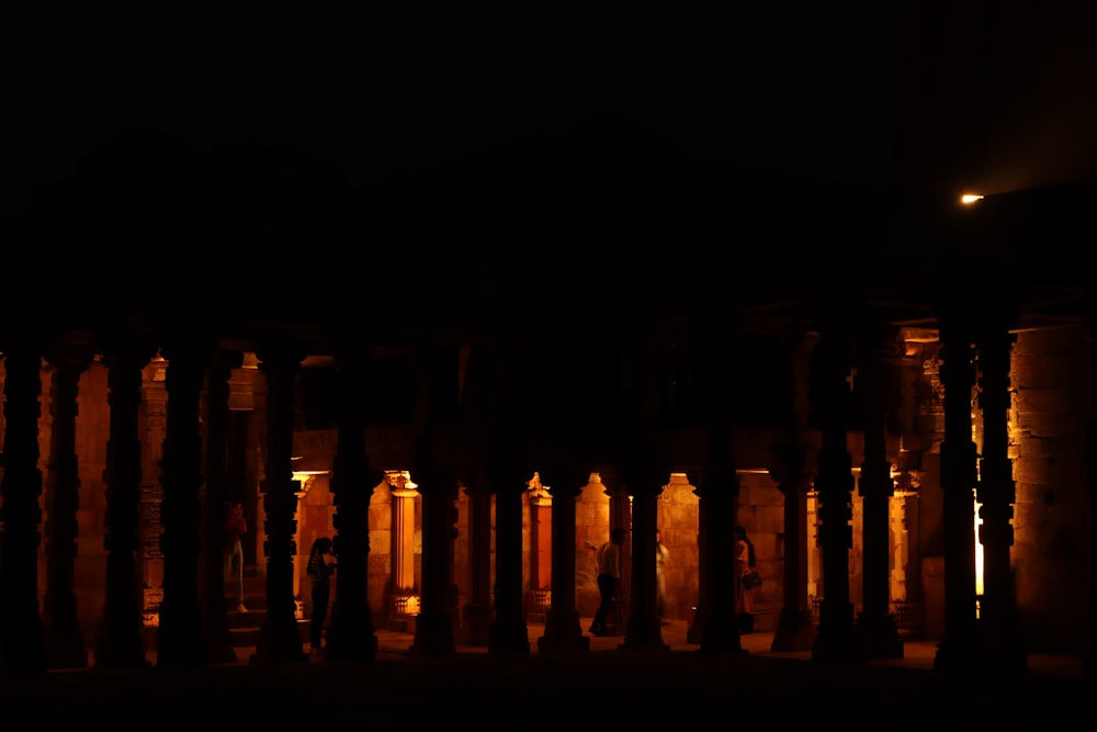 a building with columns lit up at night