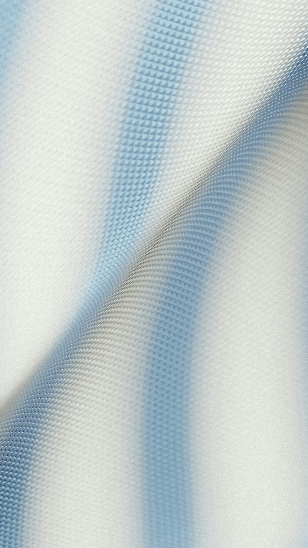 a close up of a blue and white striped fabric