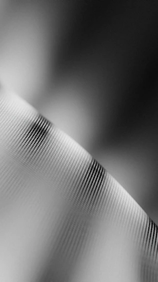 a black and white photo of a curved object