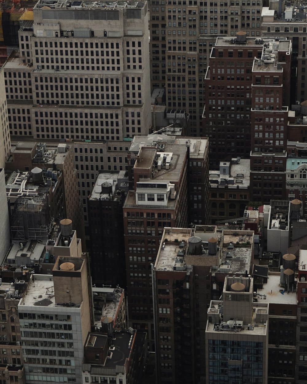 an aerial view of a city with lots of tall buildings