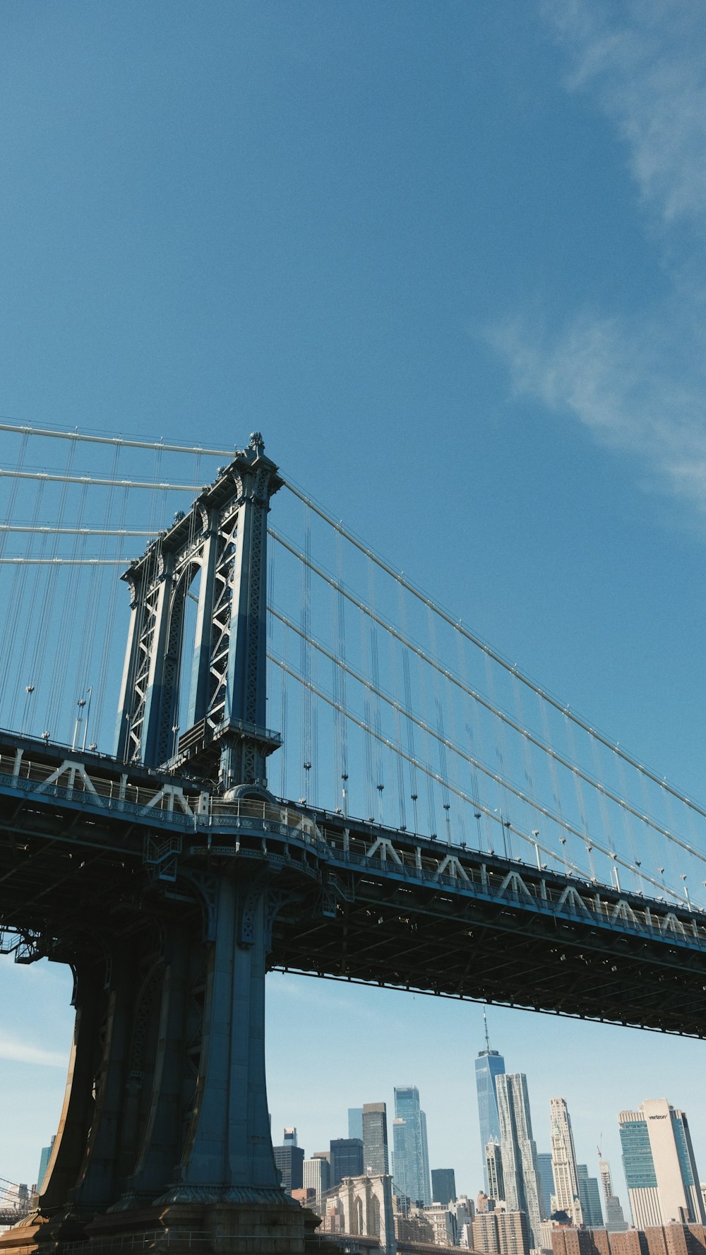 a large bridge spanning the width of a large city