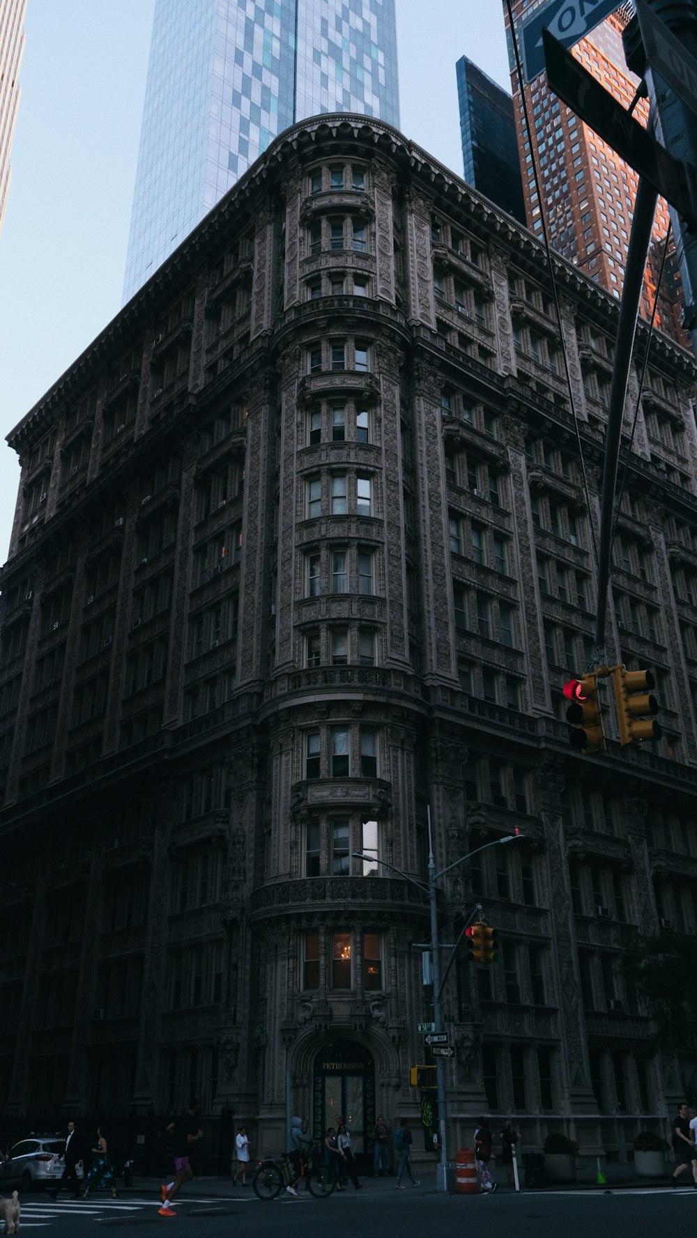 a tall building with a traffic light in front of it