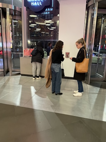 Personal shopper discussing property options with clients in a modern setting.