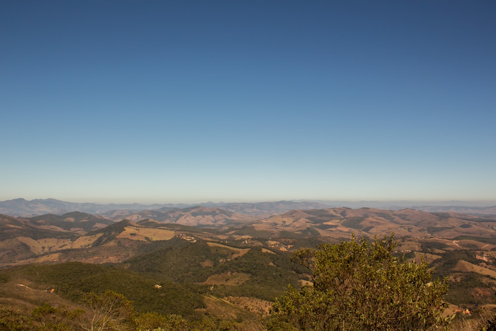 a view of a mountain range with a blue sky