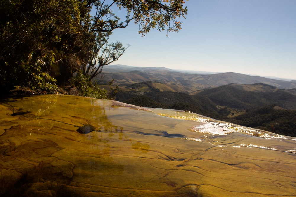 a view of a mountain range from a hot spring