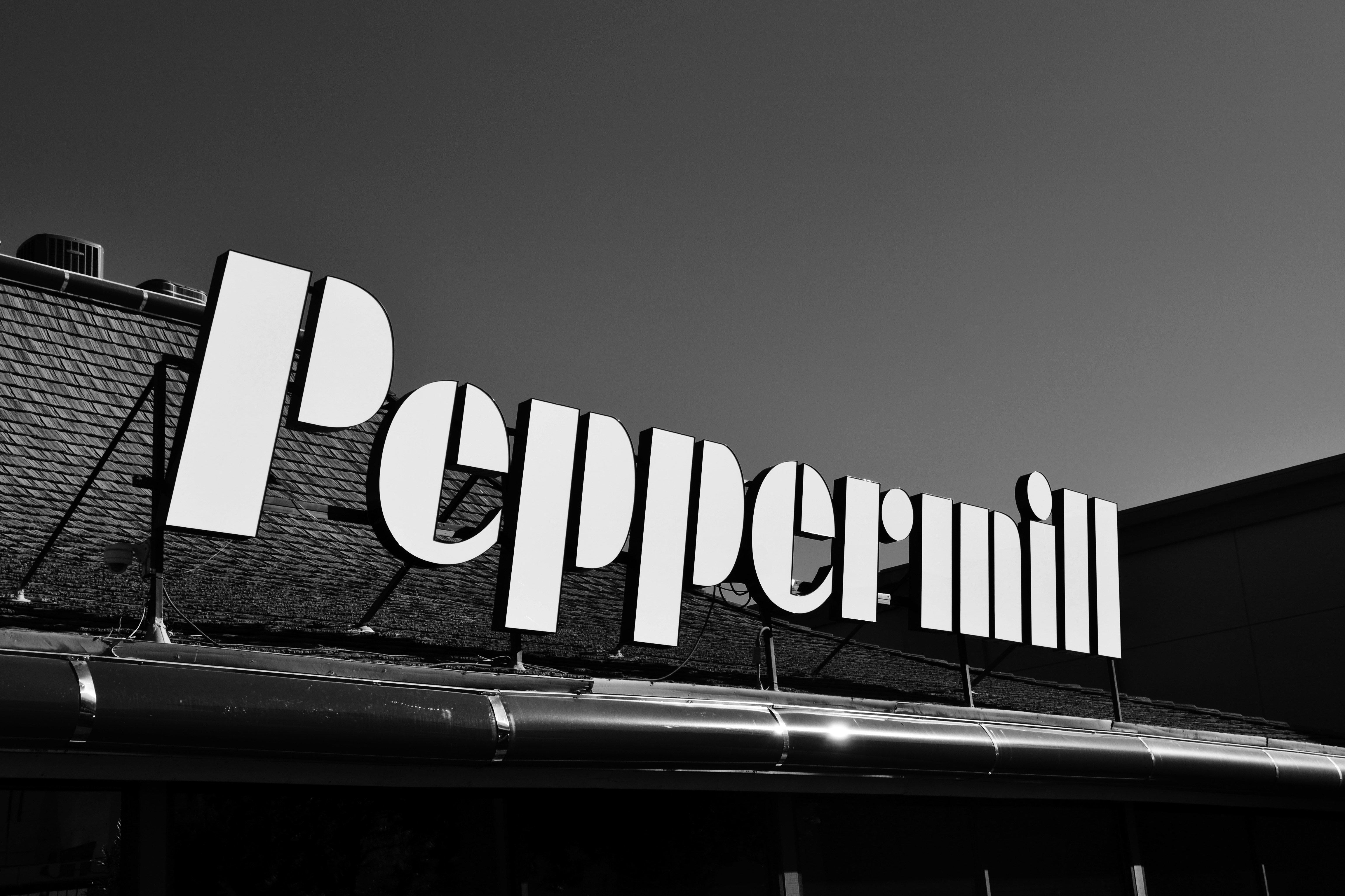 A black and white photo of a peppermill sign photo Free Las vegas