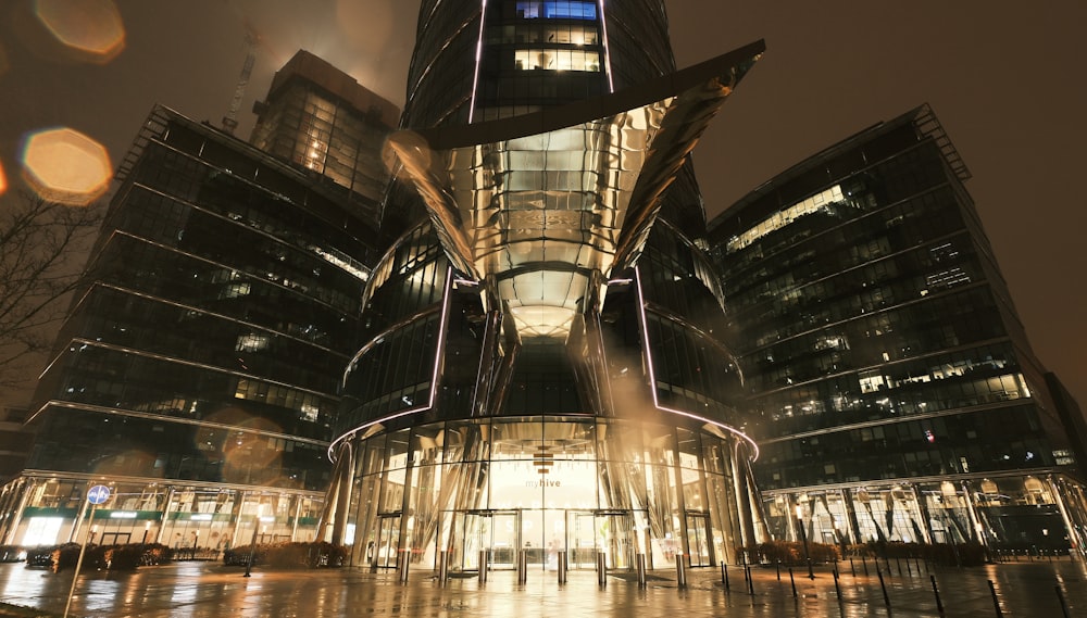 a large building with a fountain in front of it