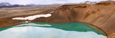 Panoramic view of the crater lake from the summit during a clear morning.