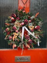 a wreath on the front door of a house