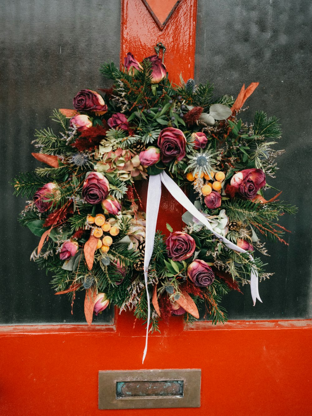 a wreath on the front door of a house