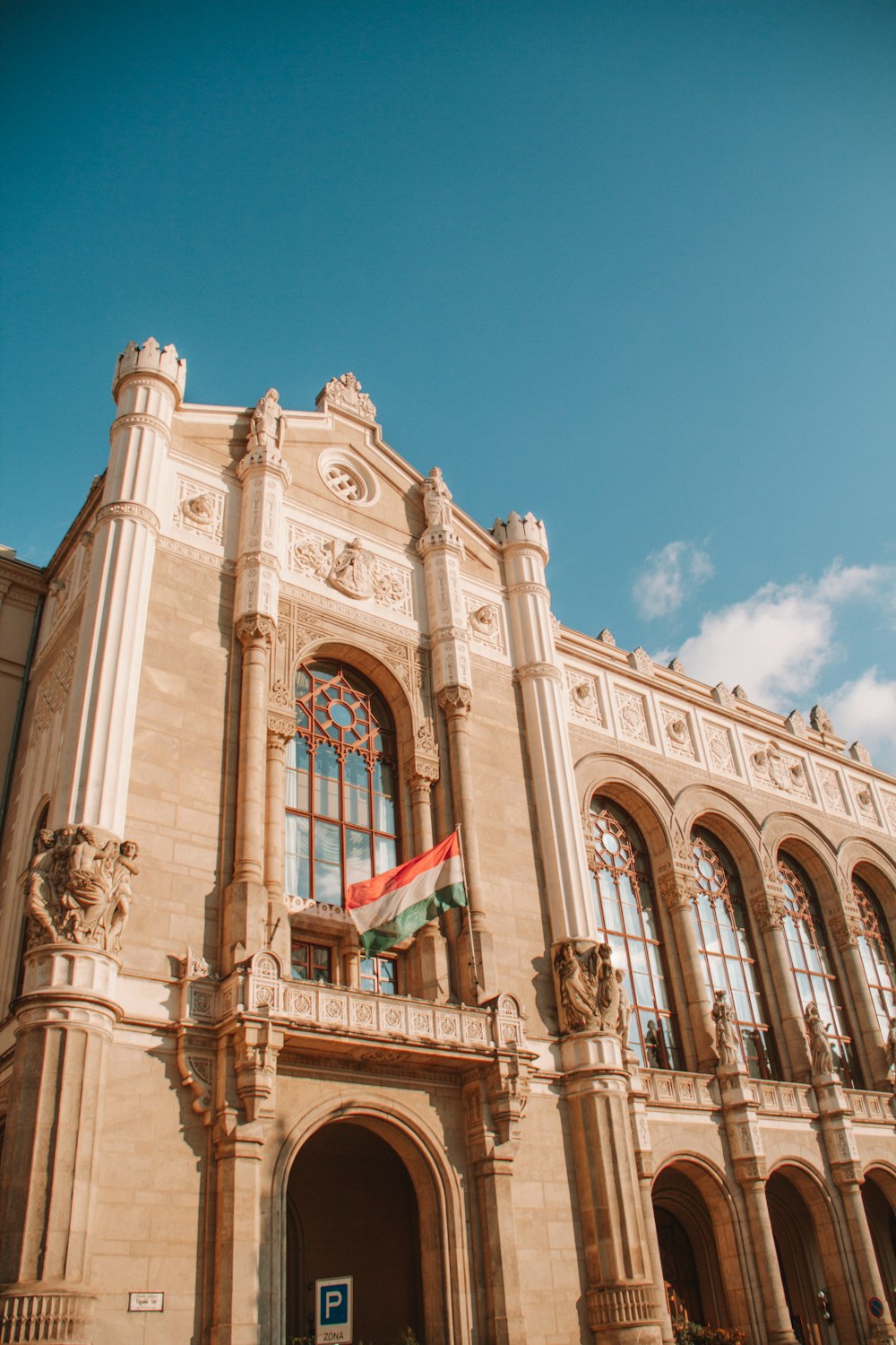 a large building with a flag on top of it