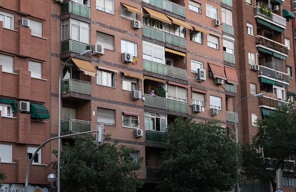 a tall brick building with balconies and balconies