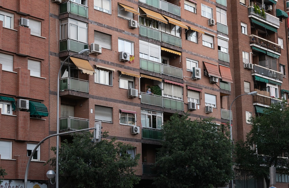 a tall brick building with balconies and balconies