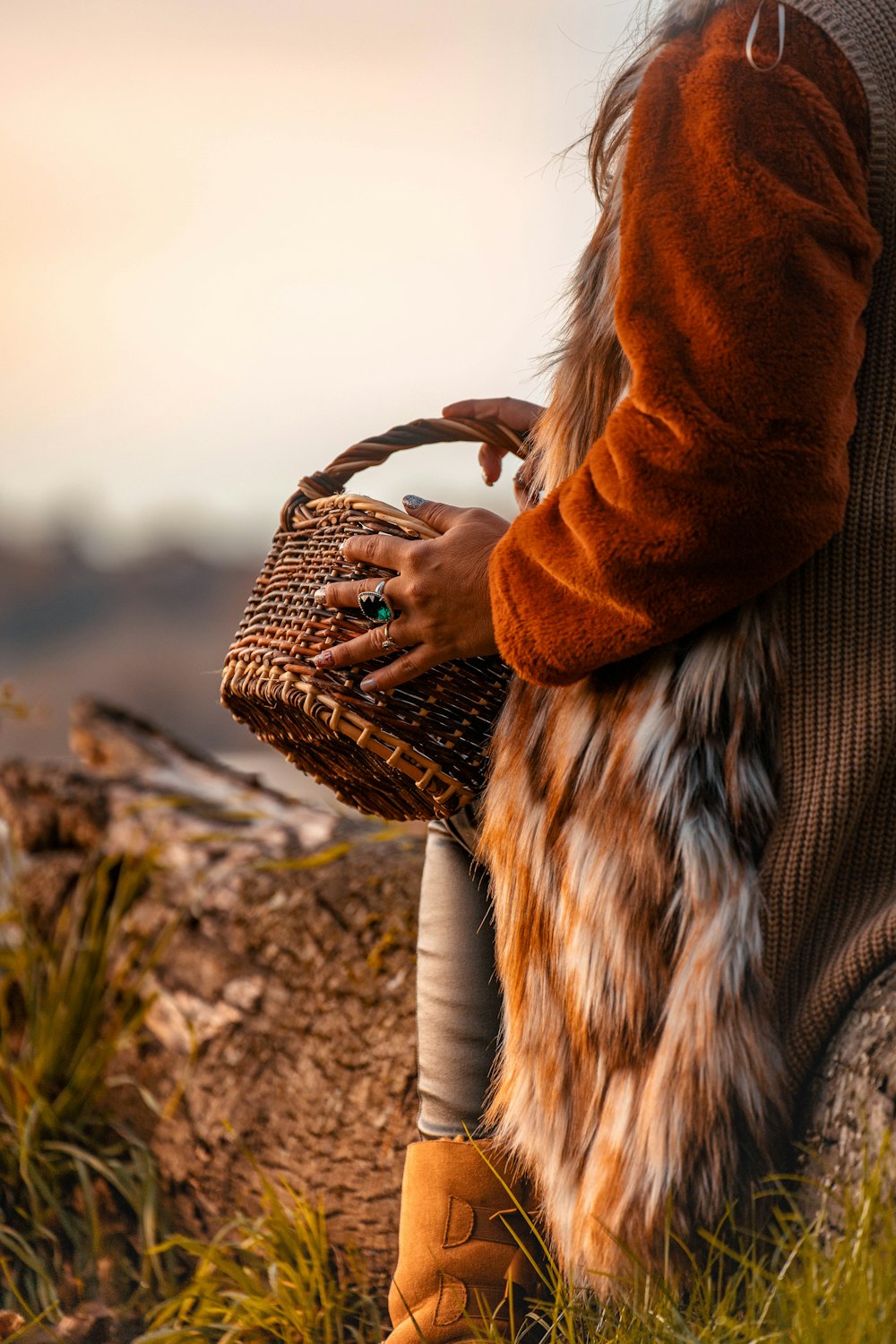 a woman holding a basket in her hands