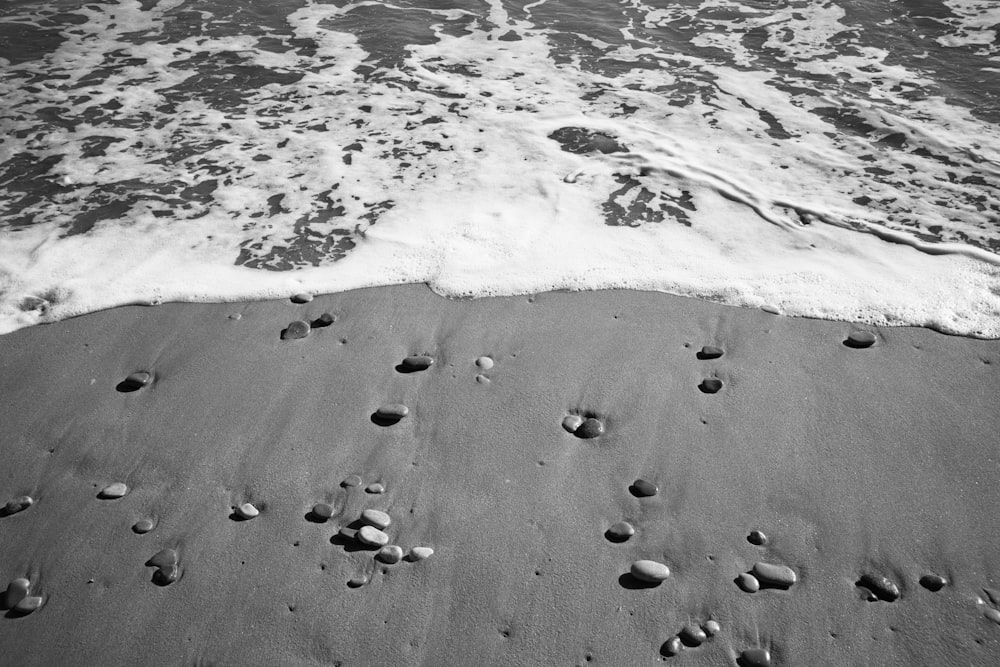 a black and white photo of a beach