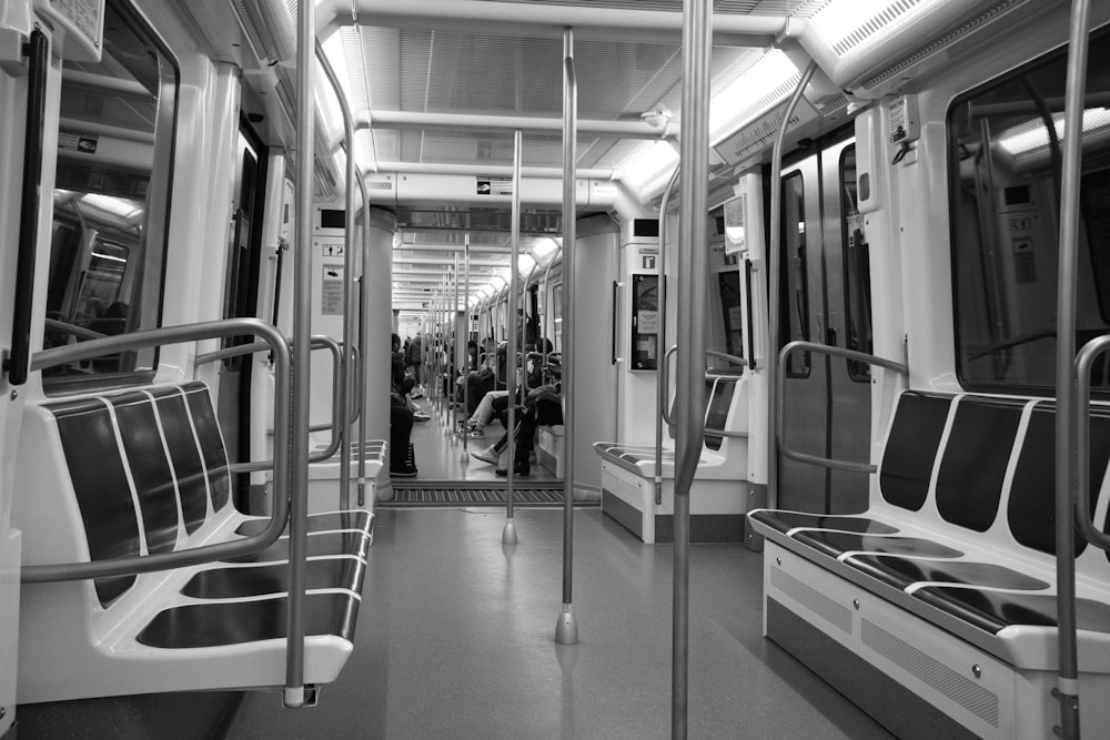 a black and white photo of a subway car